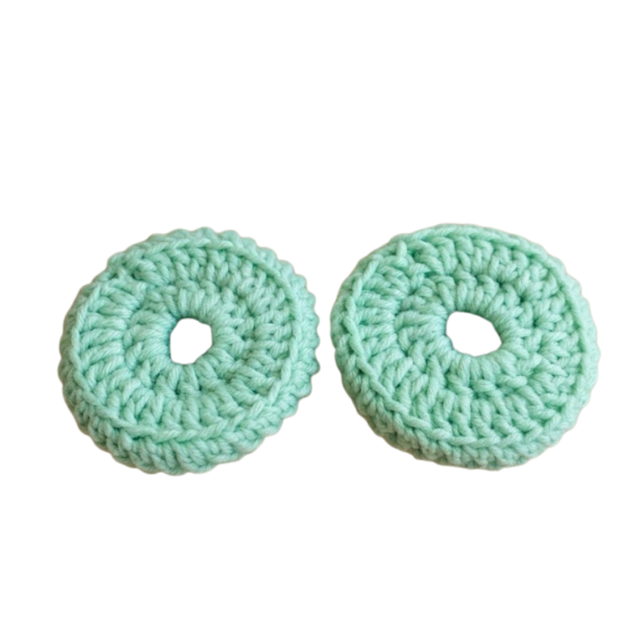 Pair of mint green crochet headset covers
